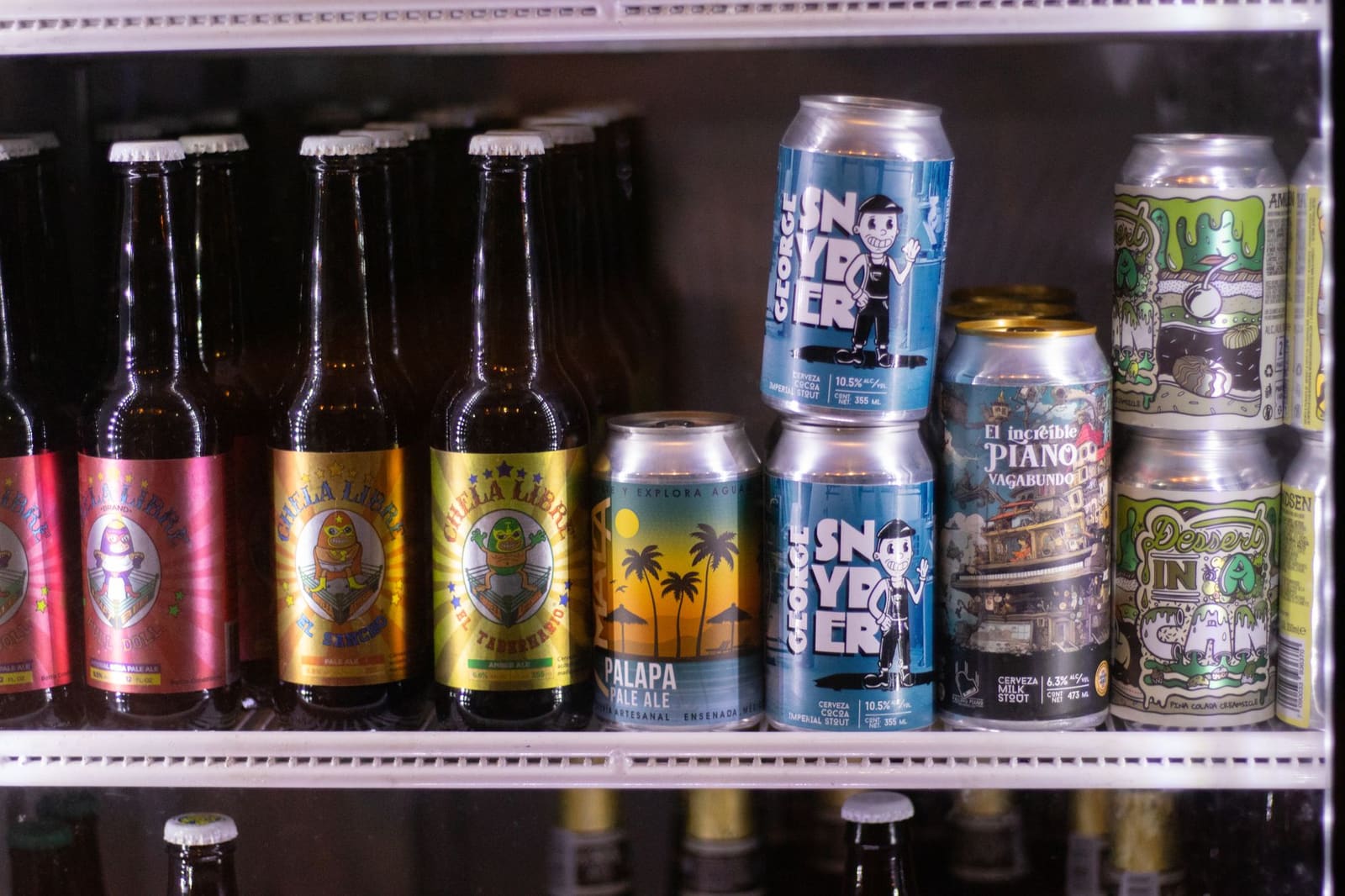 Verschillende blikjes bier naast elkaar, symbool voor uiteenlopende biersmaken